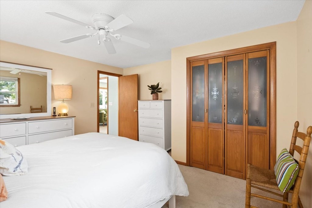 83 Brookside Road Rockland, MA 02370 - Photo 16 of 31 a spacious bedroom with a bed and a mirror