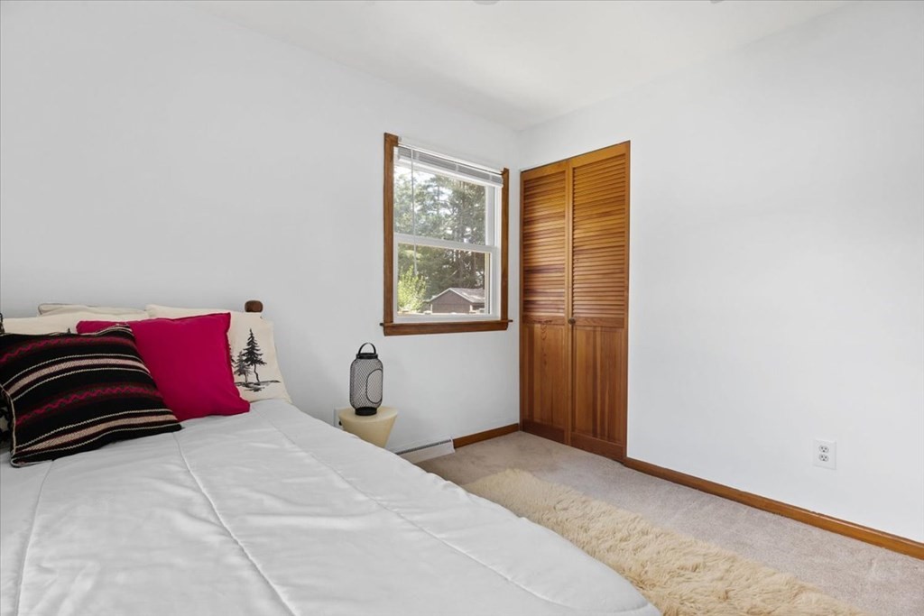 83 Brookside Road Rockland, MA 02370 - Photo 20 of 31 a bedroom with a large bed and a window