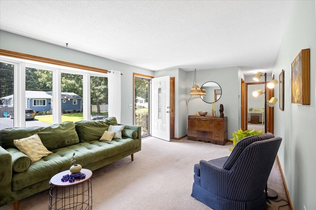 83 Brookside Road Rockland, MA 02370 - Photo 3 of 31 a living room with furniture and a large window
