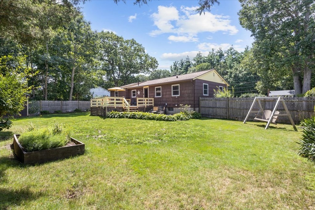 83 Brookside Road Rockland, MA 02370 - Photo 31 of 31 a view of a house with a backyard and a patio
