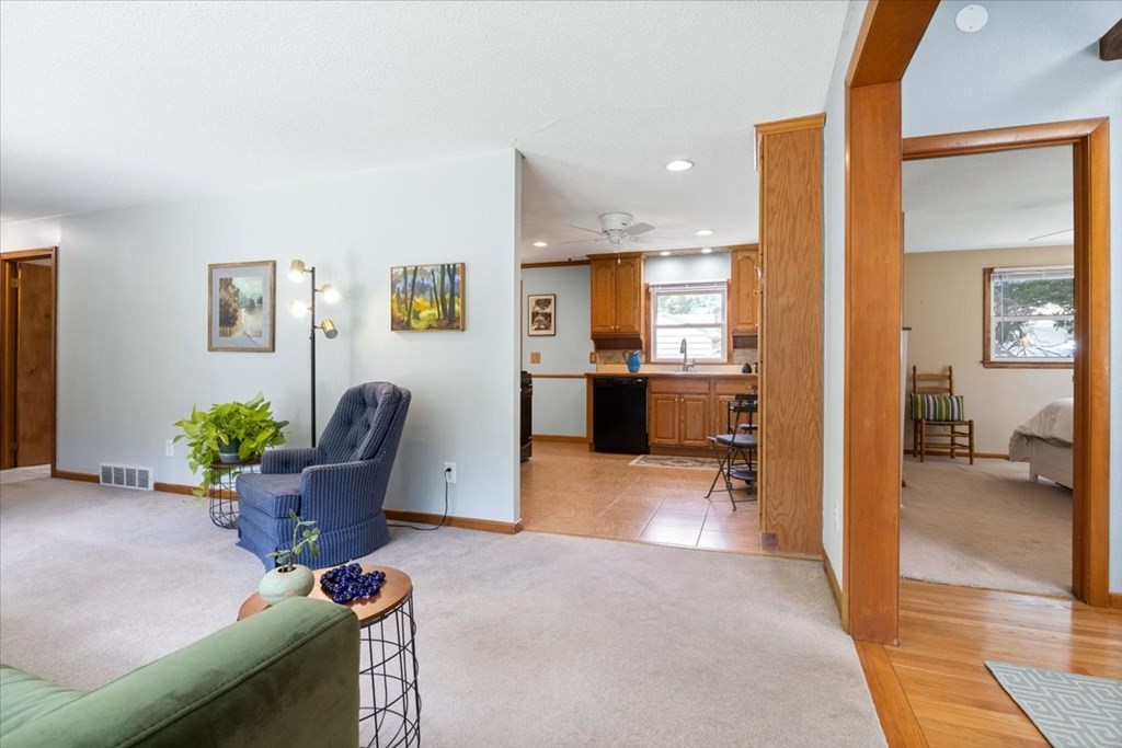 83 Brookside Road Rockland, MA 02370 - Photo 8 of 31 a living room with furniture and a kitchen