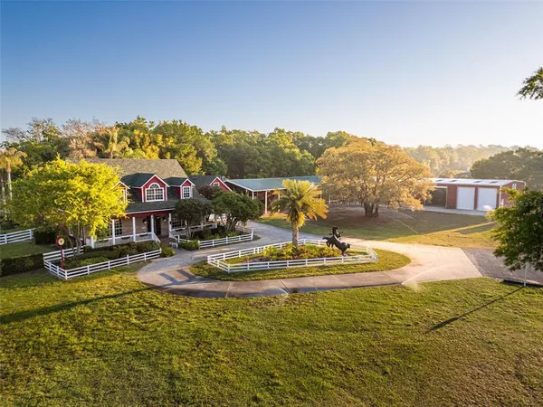 an outdoor view of a garden with an outdoor seating