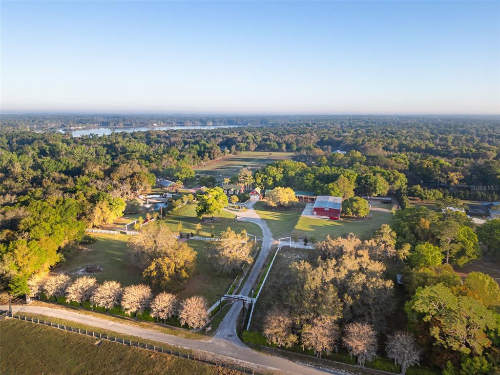 280 Campbell Ranch Run Geneva, FL 32732 - Photo 2 of 18 an aerial view of a houses with a lake view