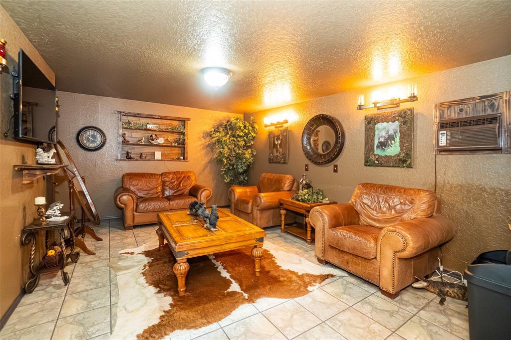 280 Campbell Ranch Run Geneva, FL 32732 - Photo 55 of 83 a living room with furniture and a clock