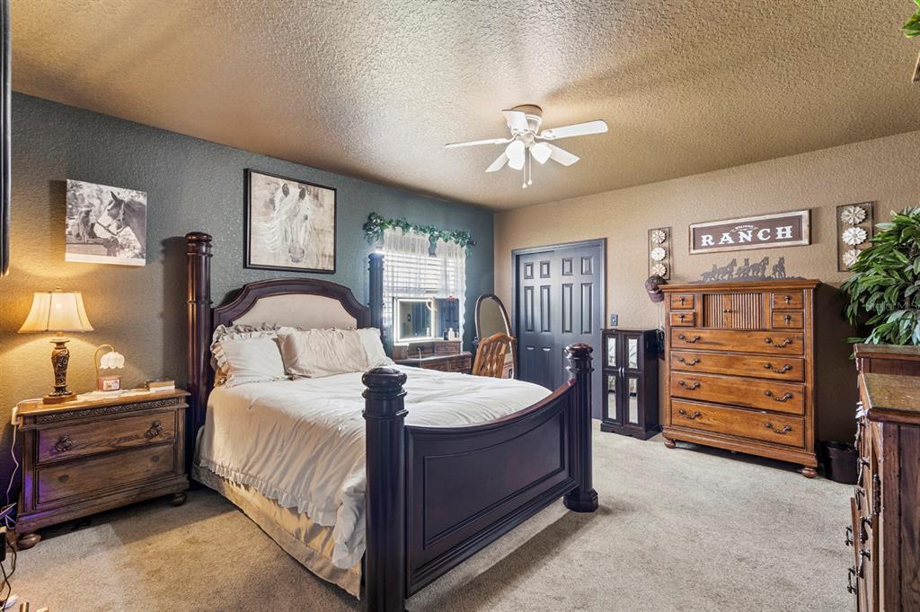280 Campbell Ranch Run Geneva, FL 32732 - Photo 62 of 83 a bedroom with a bed and a chandelier