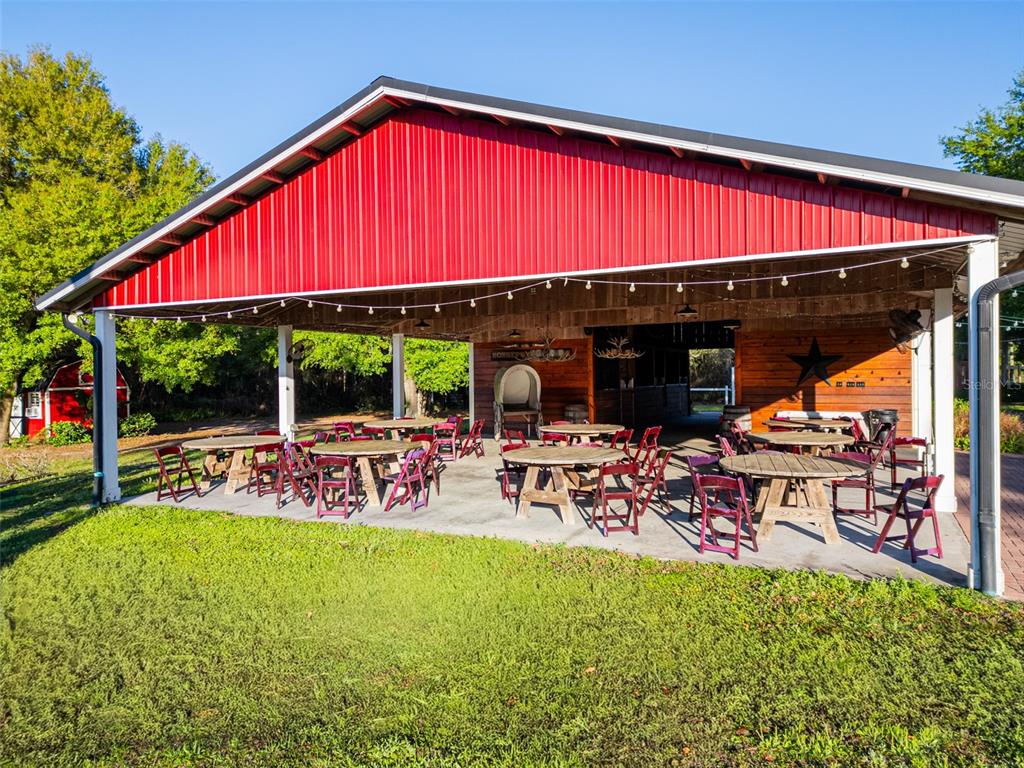 280 Campbell Ranch Run Geneva, FL 32732 - Photo 7 of 18 a view of a chairs with table in the patio