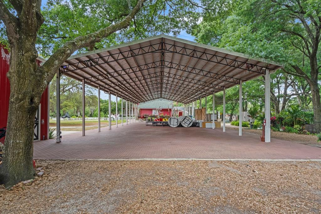 280 Campbell Ranch Run Geneva, FL 32732 - Photo 10 of 18 a blue and white house with a outdoor space