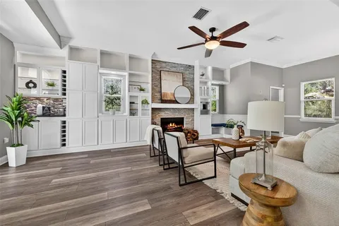 a living room with furniture and a fireplace