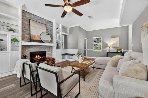 a bathroom with a granite countertop sink mirror and toilet
