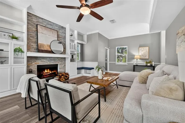 a bathroom with a granite countertop sink mirror and toilet