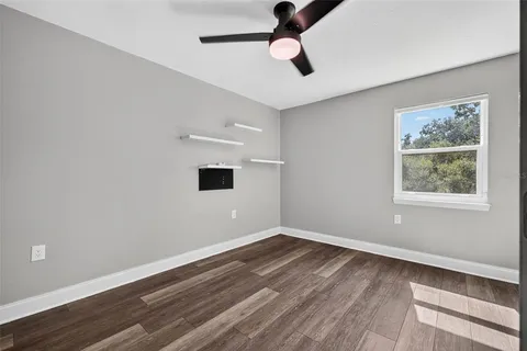 a bathroom with a sink toilet and a mirror