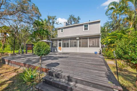 a view of house with backyard