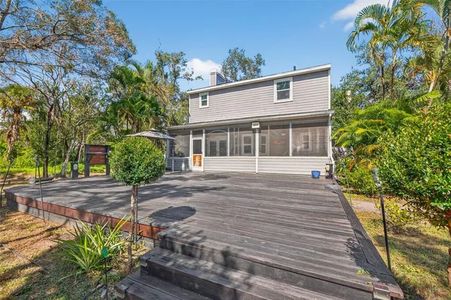 a view of house with backyard