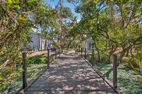 an empty room with windows and cabinet