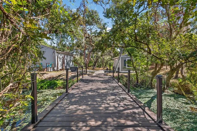 an empty room with windows and cabinet