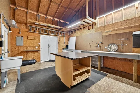 a balcony with table and chairs