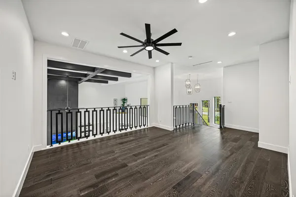 a kitchen with white cabinets and sink