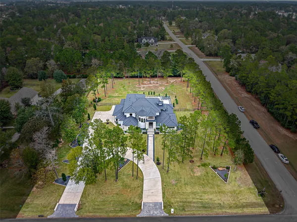 an aerial view of a house with roof deck
