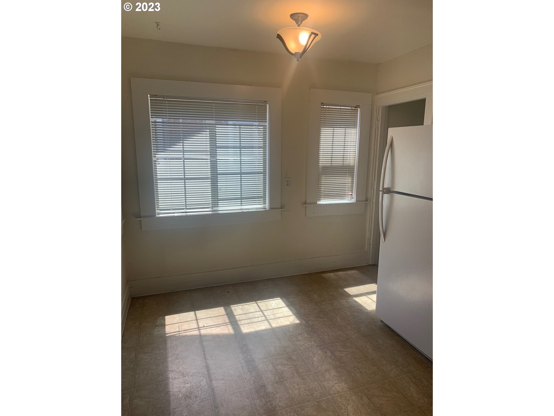 4005 Northeast 70th Avenue Portland, OR 97213 - Photo 11 of 27 a view of empty room with wooden floor and fan