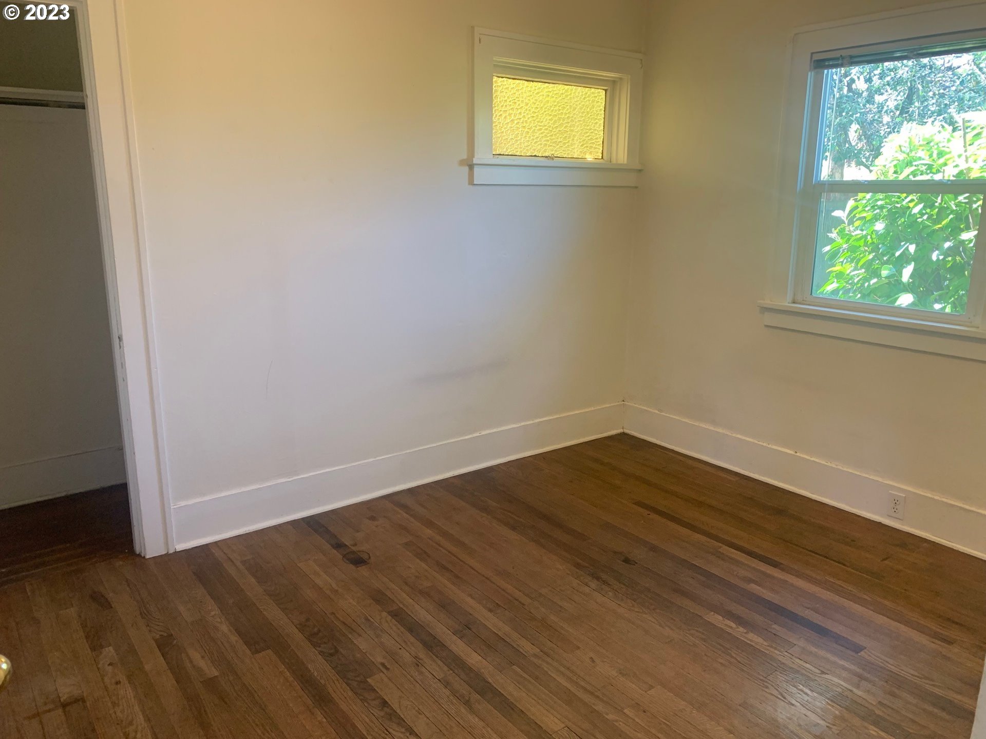 4005 Northeast 70th Avenue Portland, OR 97213 - Photo 12 of 27 a view of an empty room with wooden floor and a window