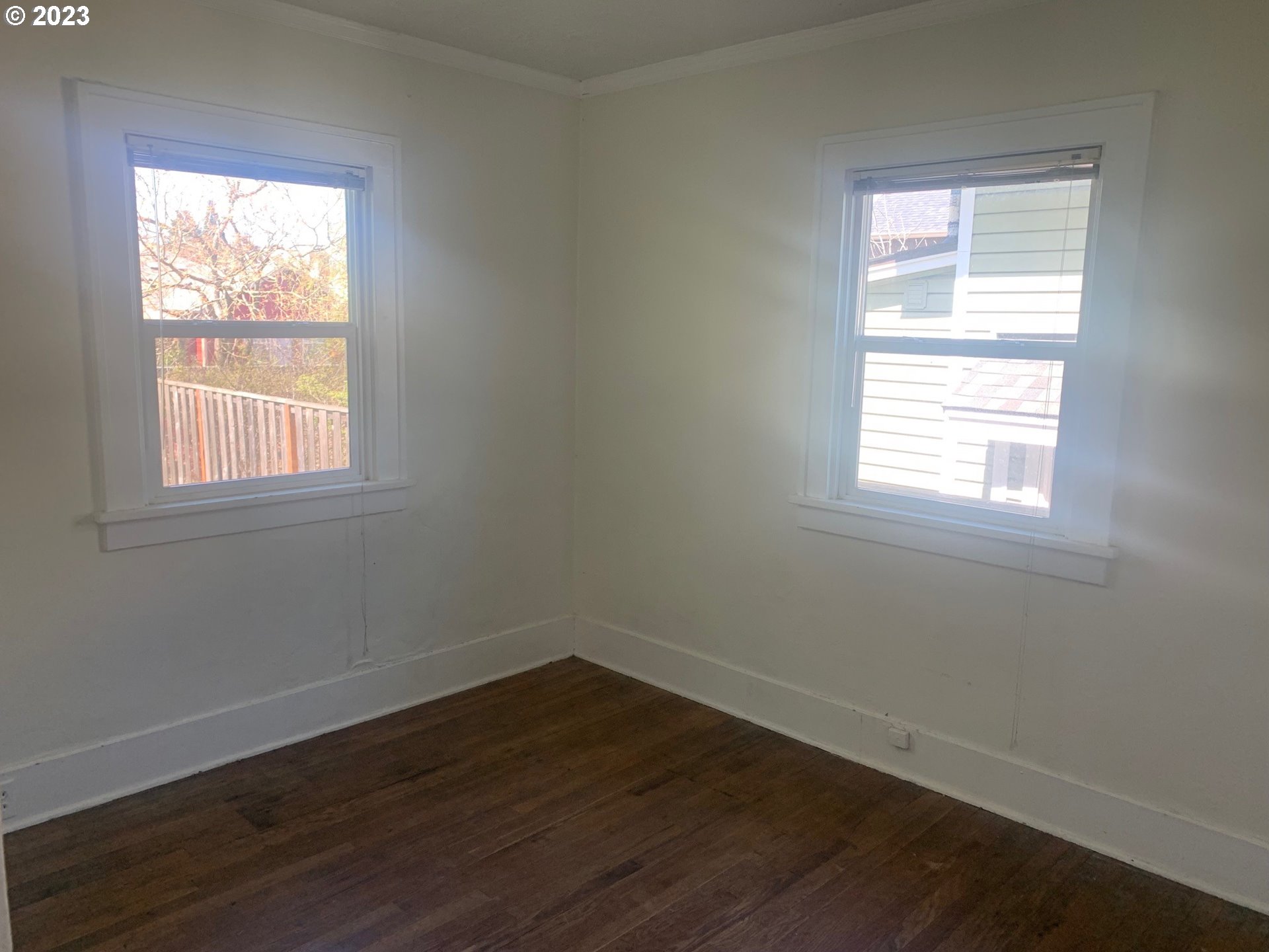 4005 Northeast 70th Avenue Portland, OR 97213 - Photo 14 of 27 an empty room with wooden closet and windows