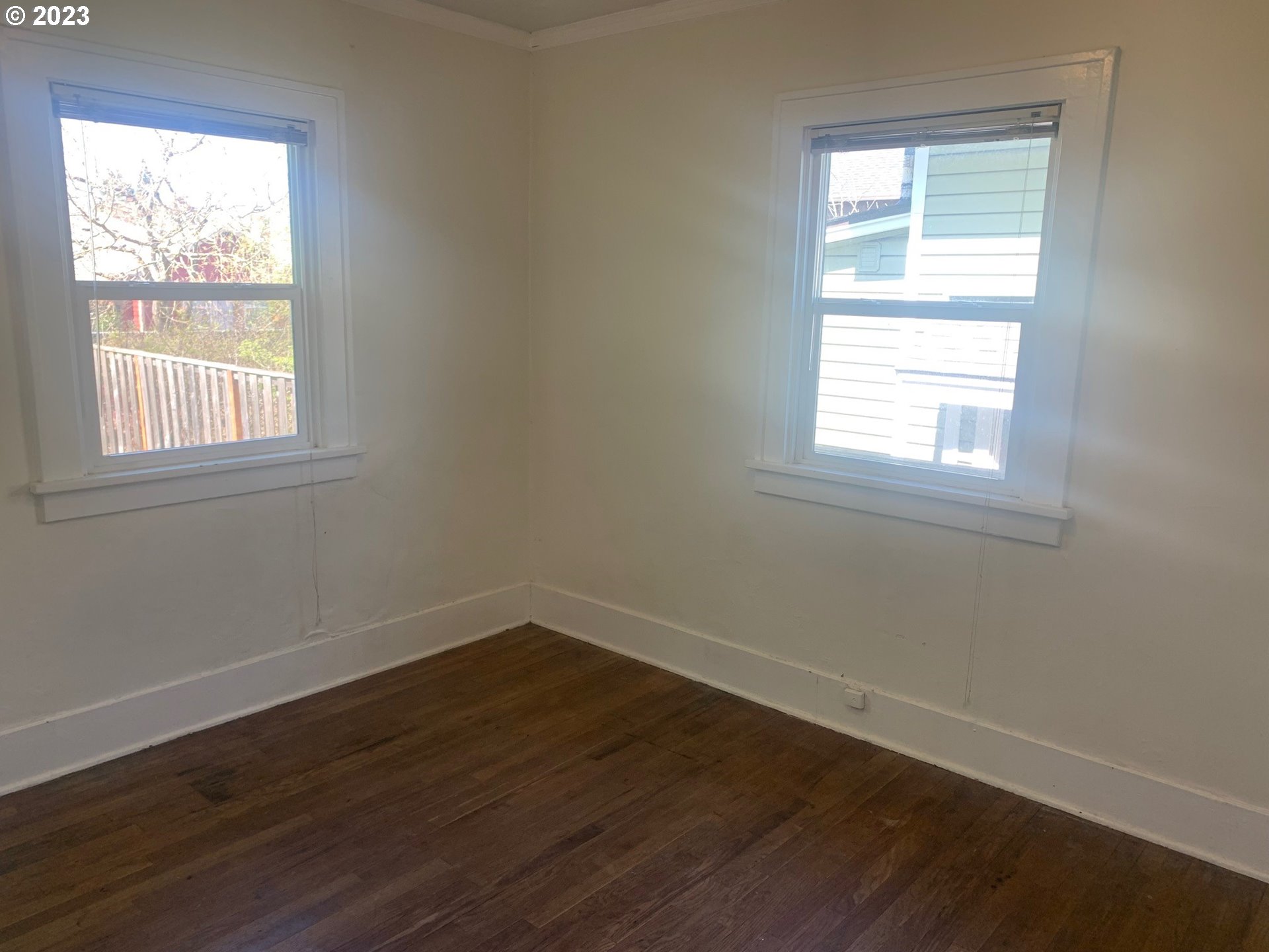 4005 Northeast 70th Avenue Portland, OR 97213 - Photo 15 of 27 an empty room with wooden floor and windows