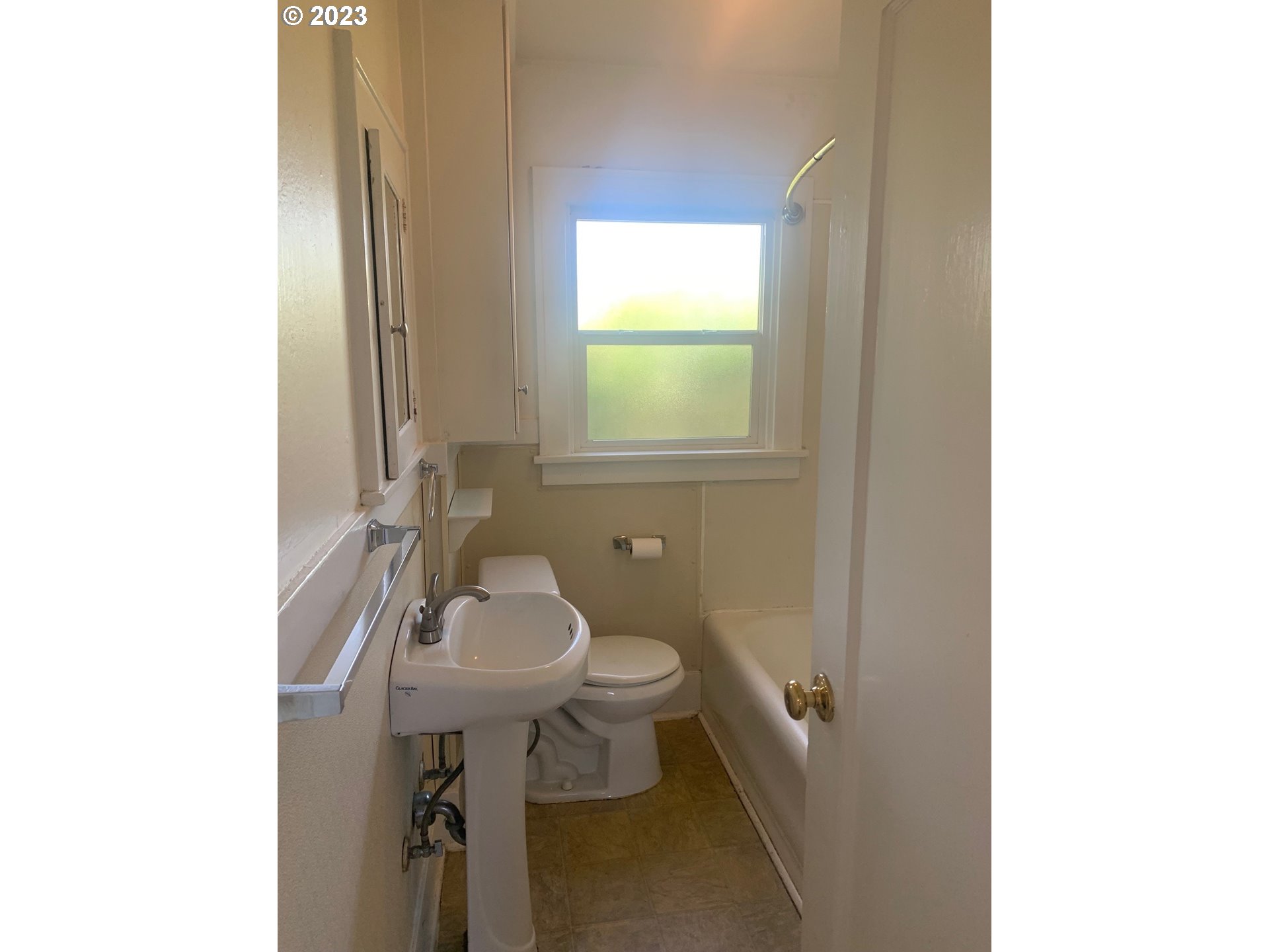 4005 Northeast 70th Avenue Portland, OR 97213 - Photo 17 of 27 a bathroom with a sink toilet and a mirror