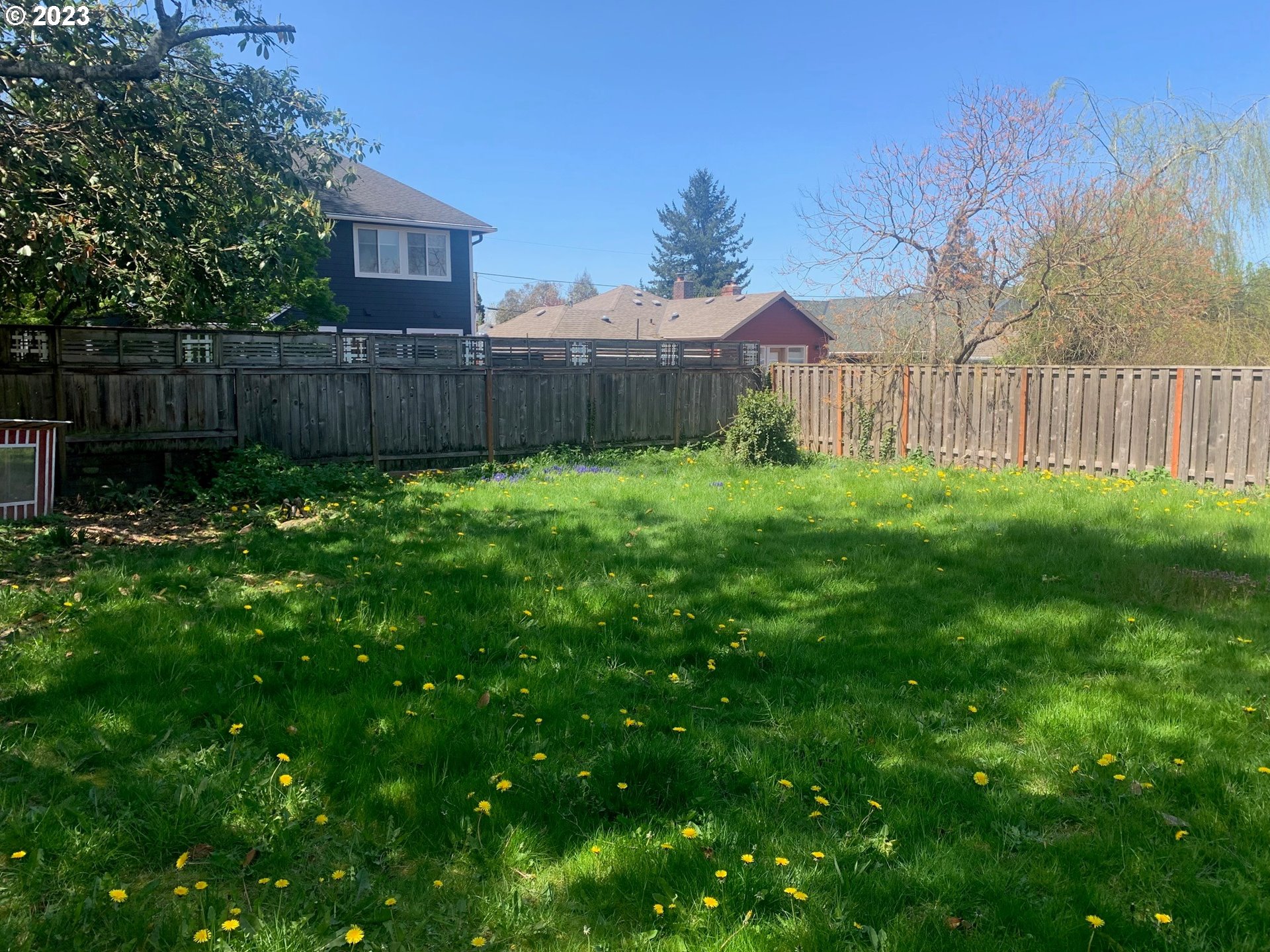 4005 Northeast 70th Avenue Portland, OR 97213 - Photo 25 of 27 a view of a backyard with wooden fence