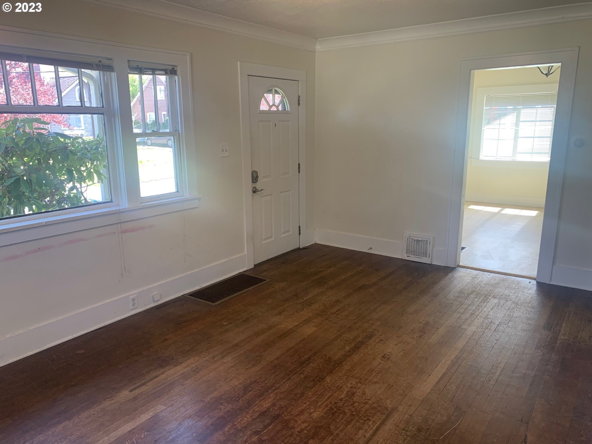 4005 Northeast 70th Avenue Portland, OR 97213 - Photo 5 of 27 an empty room with wooden floor and windows