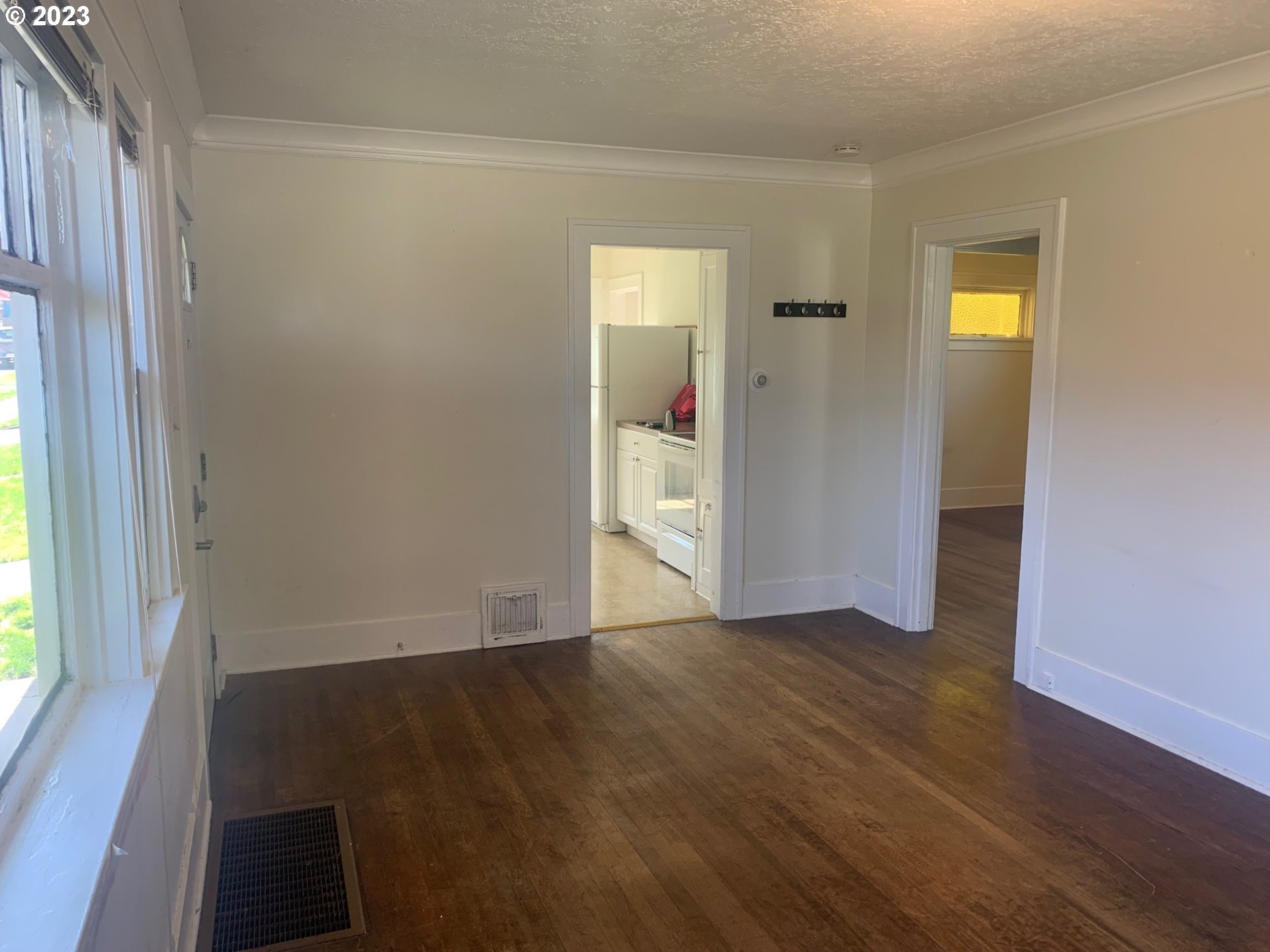 4005 Northeast 70th Avenue Portland, OR 97213 - Photo 6 of 27 an empty room with wooden floor and windows