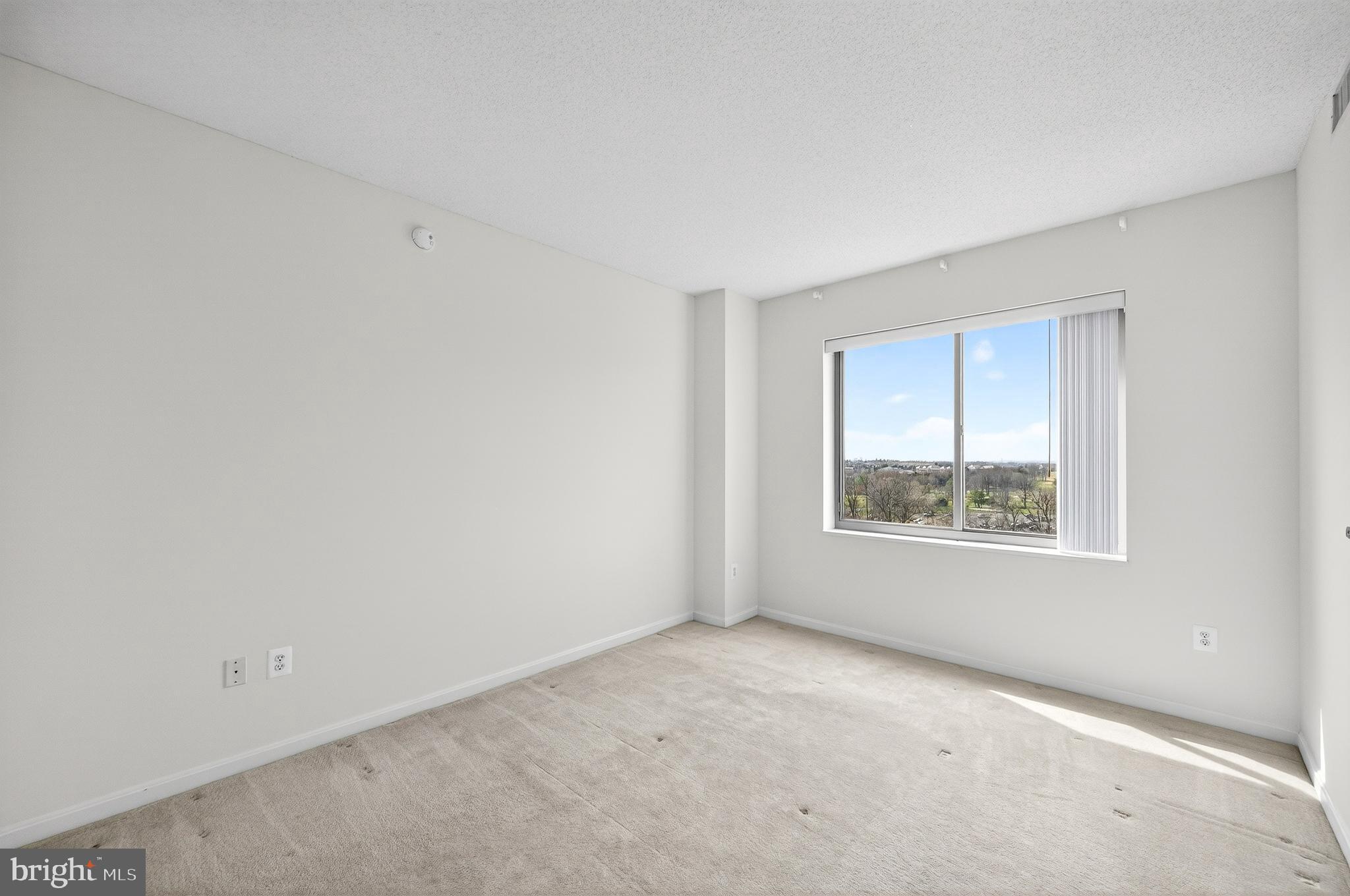 19355 Cypress Ridge Terrace, Unit 1122 Leesburg, VA 20176 - Photo 35 of 71 an empty room with windows