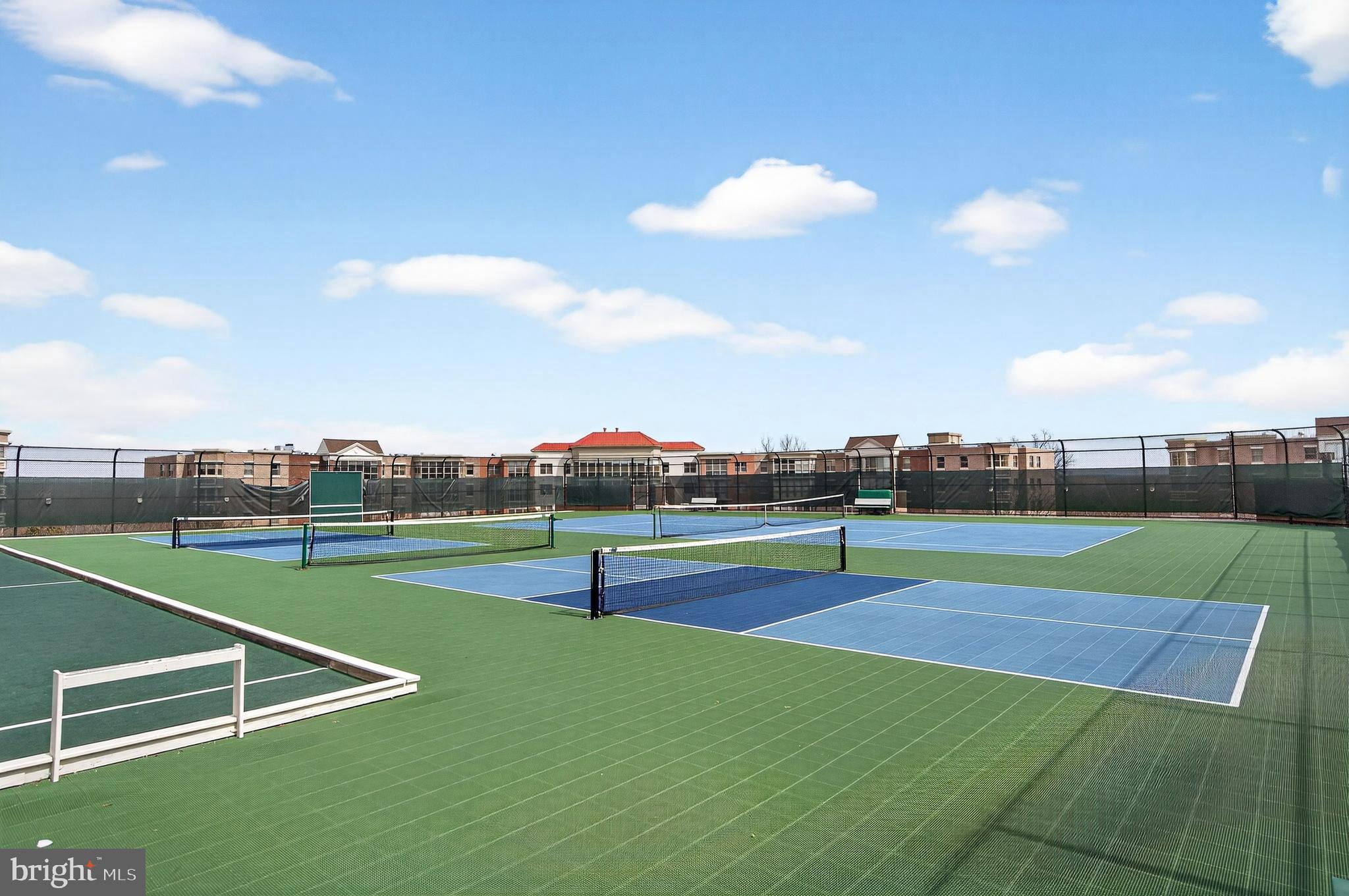 19355 Cypress Ridge Terrace, Unit 1122 Leesburg, VA 20176 - Photo 42 of 71 a view of an outdoor space and tennis court