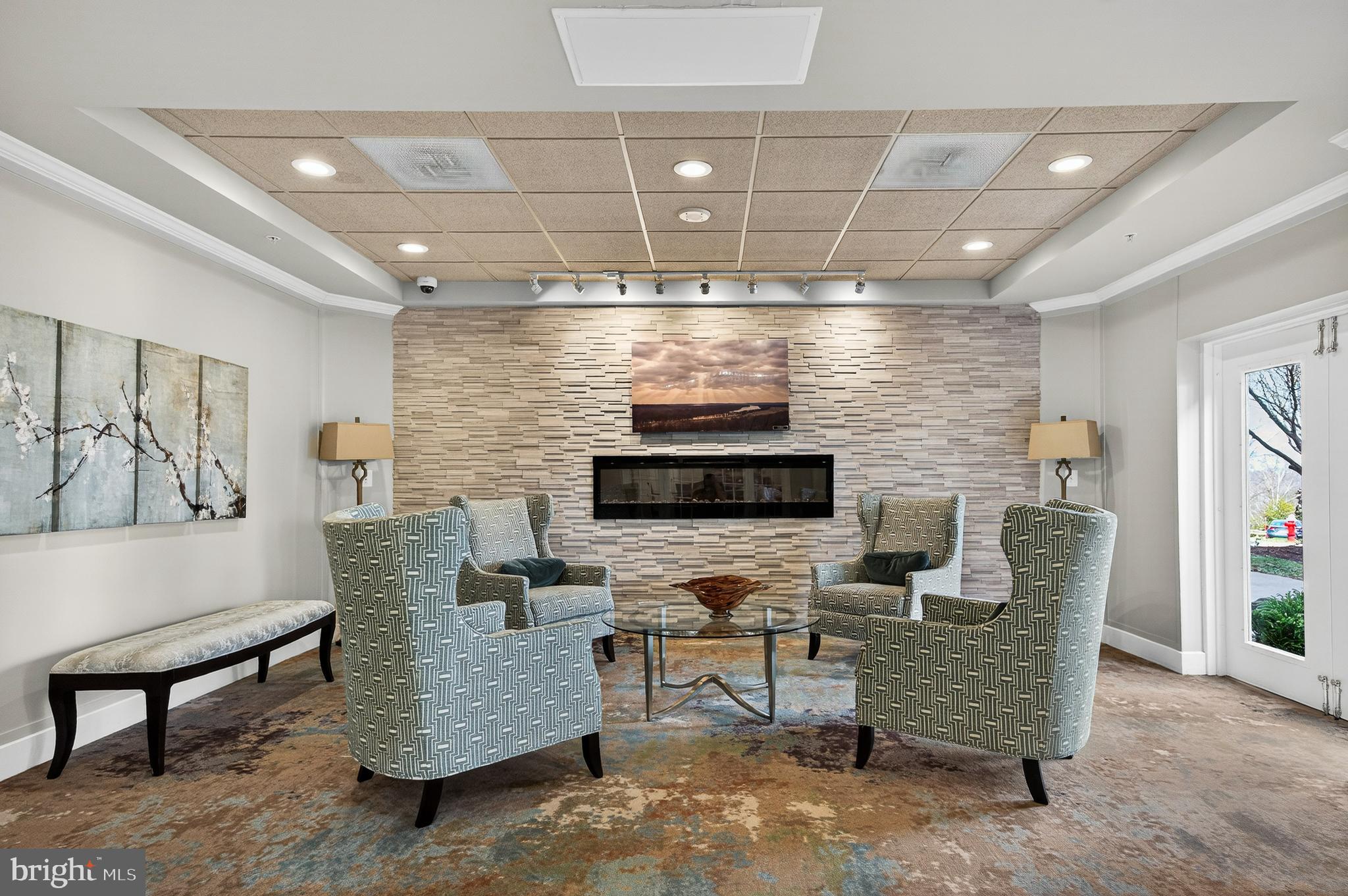19355 Cypress Ridge Terrace, Unit 1122 Leesburg, VA 20176 - Photo 46 of 71 a living room with furniture and a flat screen tv