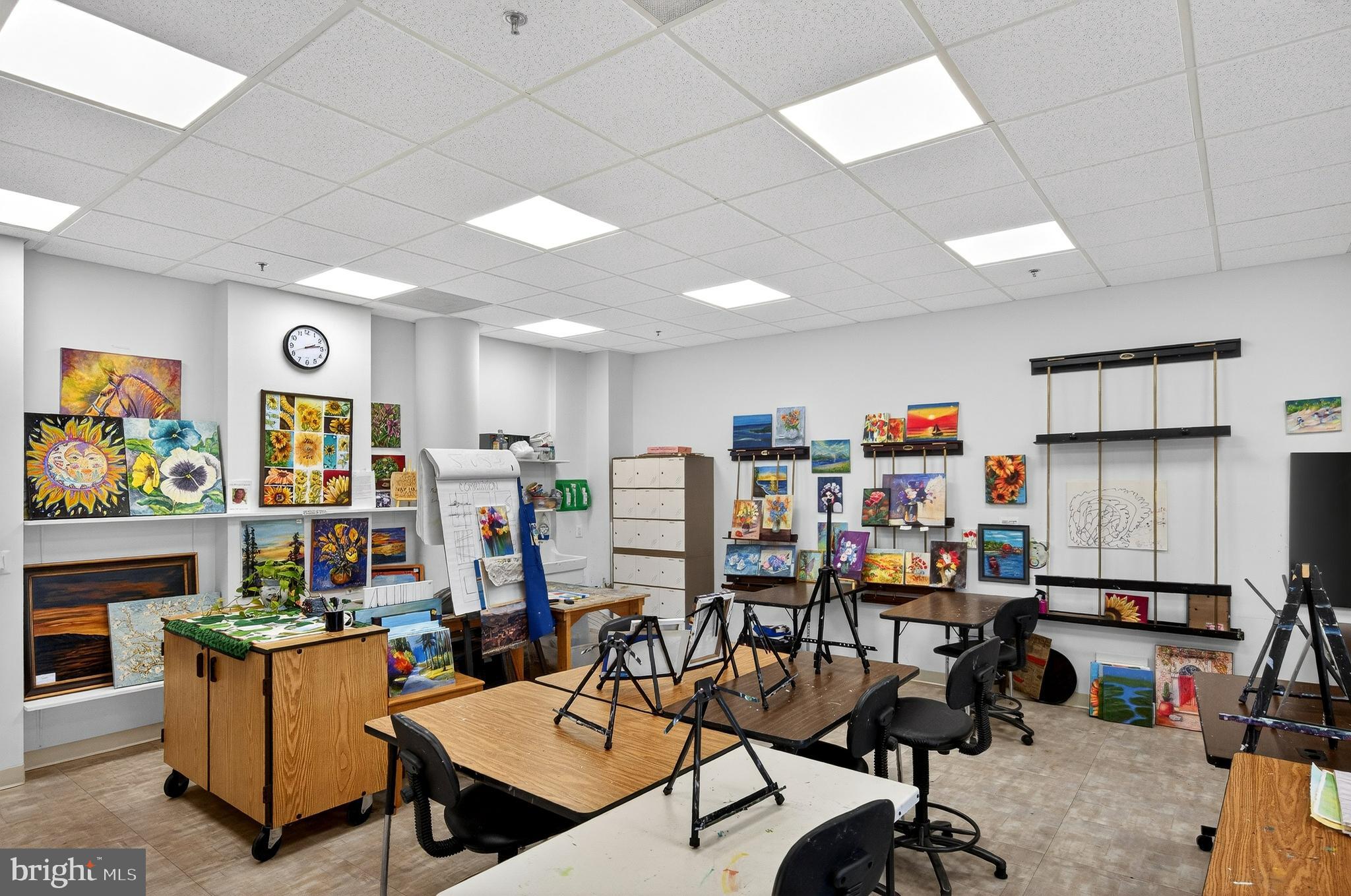 19355 Cypress Ridge Terrace, Unit 1122 Leesburg, VA 20176 - Photo 52 of 71 a view of a room with lots of furniture and gym equipment