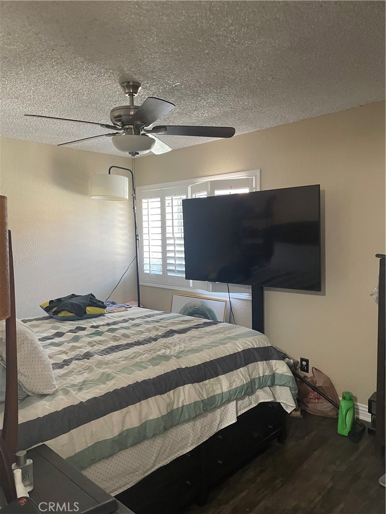 1707 Garvey Avenue, Unit 12 Alhambra, CA 91803 - Photo 14 of 22 a bedroom with a bed and a flat screen tv
