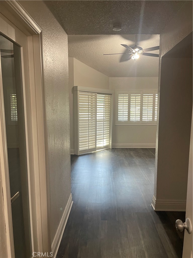1707 Garvey Avenue, Unit 12 Alhambra, CA 91803 - Photo 15 of 22 an empty room with wooden floor and windows
