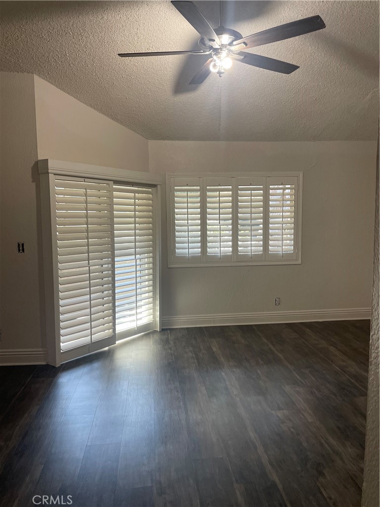 1707 Garvey Avenue, Unit 12 Alhambra, CA 91803 - Photo 16 of 22 an empty room with wooden floor and windows