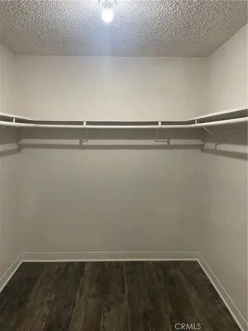 a white toilet sitting next to a shower