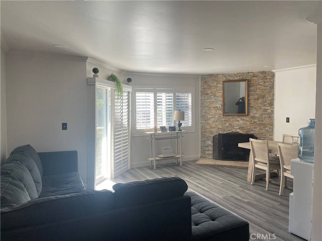 1707 Garvey Avenue, Unit 12 Alhambra, CA 91803 - Photo 3 of 22 a living room with furniture and a fireplace
