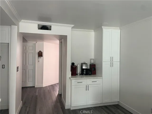 a kitchen with a sink and a stove top oven