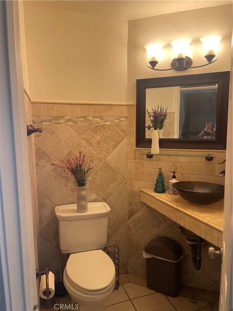 1707 Garvey Avenue, Unit 12 Alhambra, CA 91803 - Photo 9 of 22 a bathroom with a toilet a sink and mirror