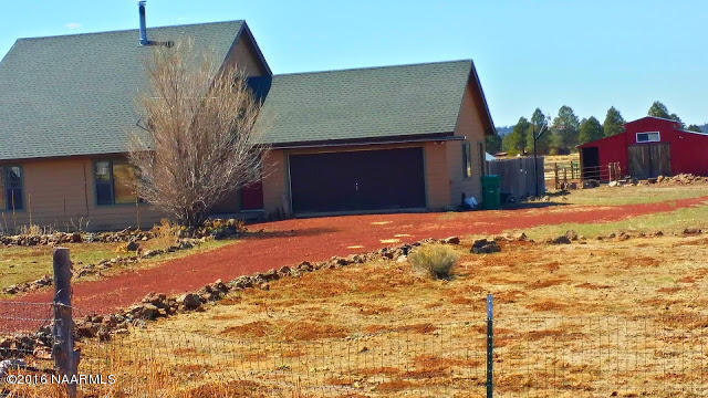 3224 Government Prairie Road Parks, AZ 86018 - Photo 26 of 27 driveway towards barn