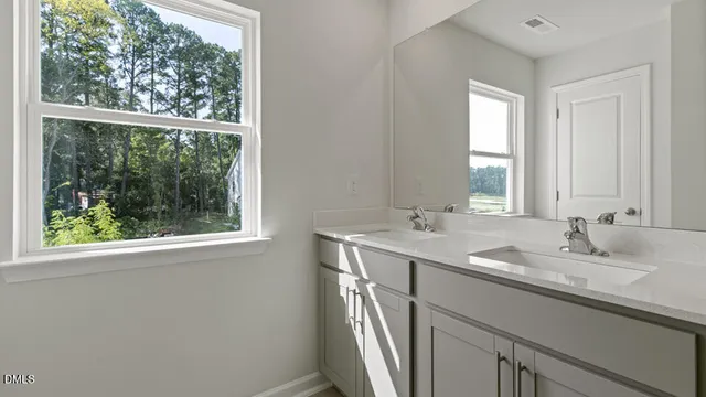 a kitchen with a refrigerator and a stove top oven