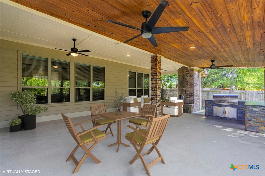 8 Daingerfield Cove Morgan's Point Resort, TX 76513 - Photo 27 of 28 a view of a patio with a dining table and chairs