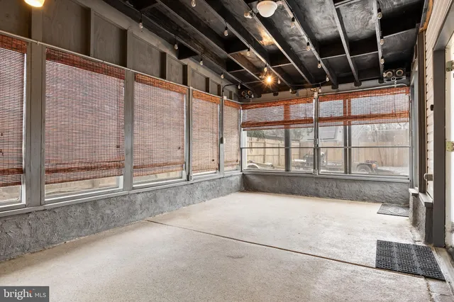 a view of an empty room with a balcony