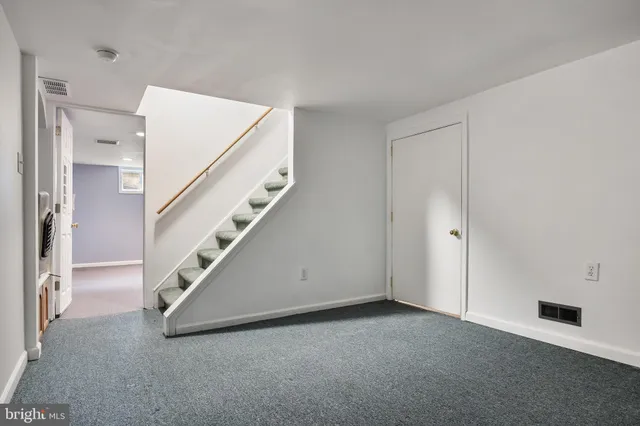 a view of a hallway with staircase
