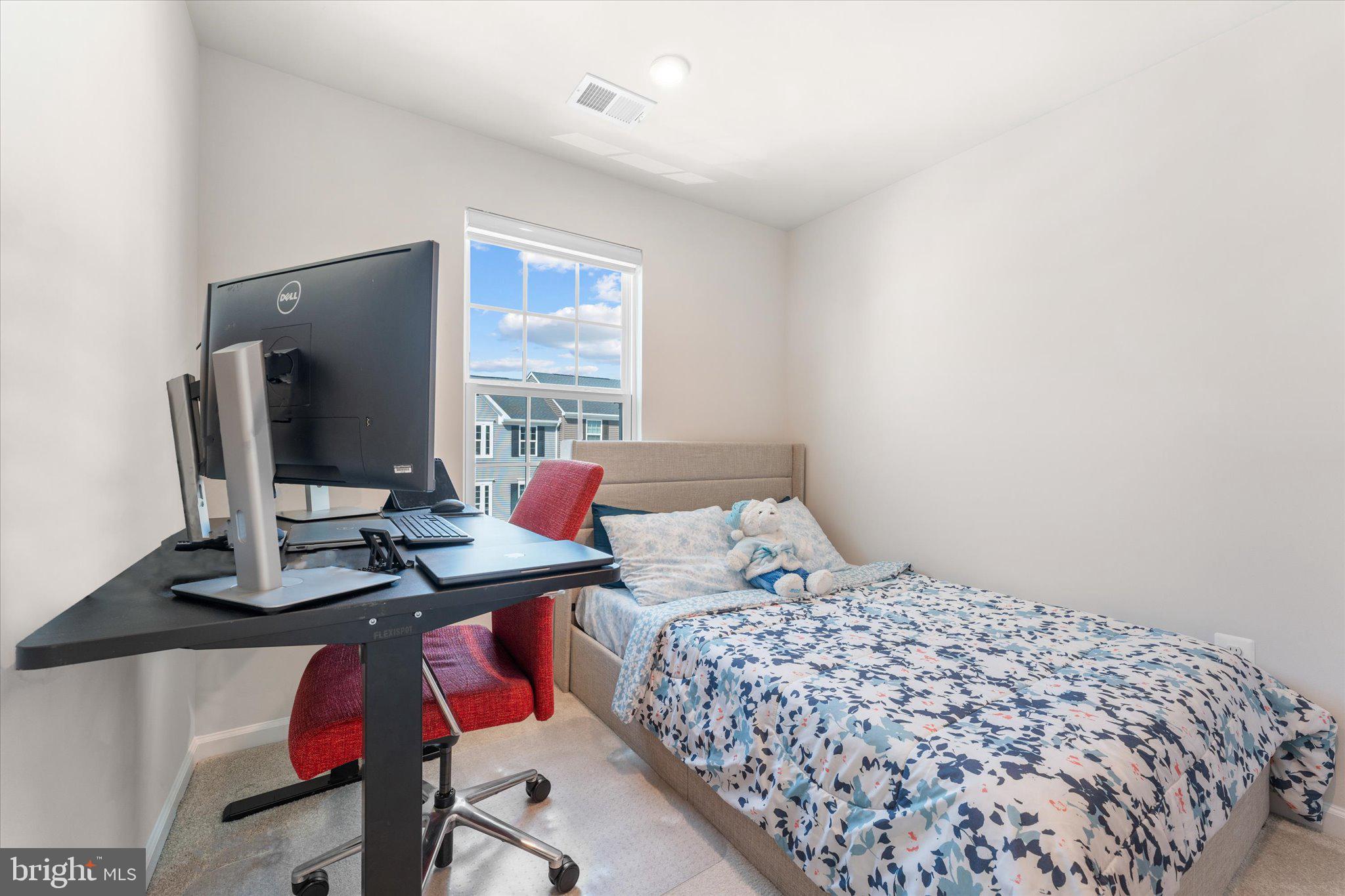 1776 Scenic Loop Culpeper, VA 22701 - Photo 26 of 36 a bedroom with a bed and a flat screen tv