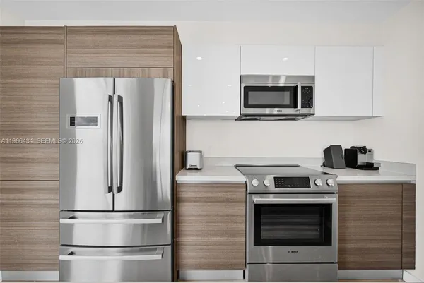 a view of a hallway with paintings on the wall