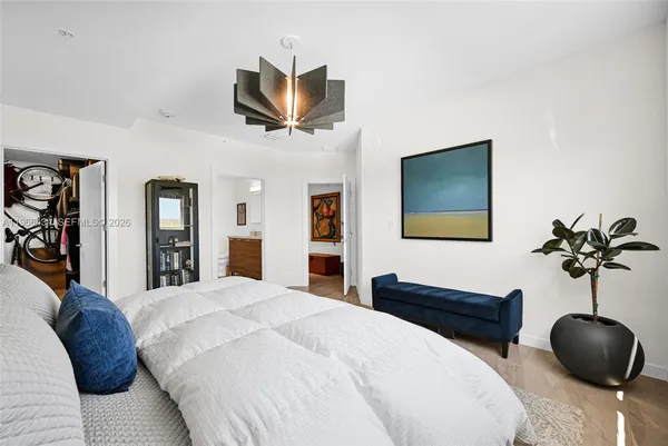 a bedroom with a bed and a couch