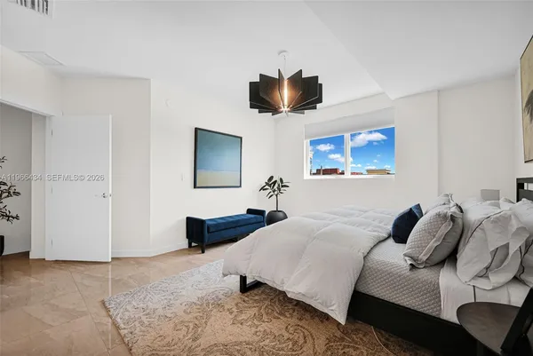 a view of walk in closet with clothes